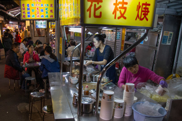 Diners eat at a food stall in Taiwan.