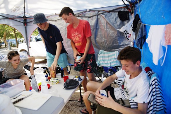 Schoolies George Muscat, Javier Cusching and Lachlan Nairn from Turramurra High School camp at Reflections Holiday Park on Clarkes Beach in Byron Bay.