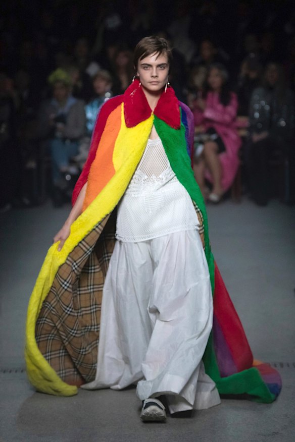 Model Cara Delevingne wears a creation by designer Burberry at the Autumn/Winter 2018 fashion week runway show in London.