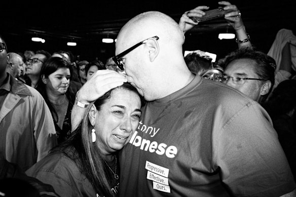 A Labor supporter breaks into tears of joy.