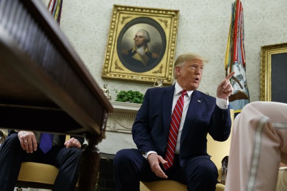 President Donald Trump speaks during a meeting.