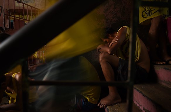 Inmates sleep on the stairs inside Quezon City Jail, Manila, Philippines.