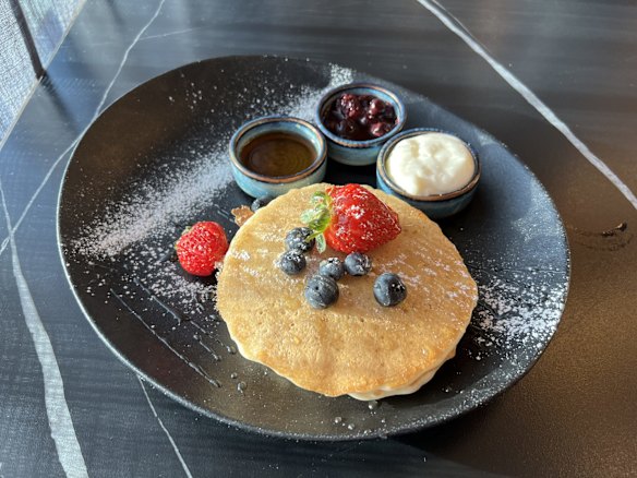 Light and fluffy pancakes served with chantilly cream and berry compote.