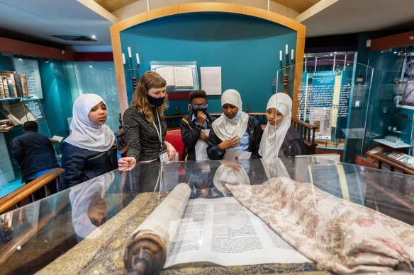 Jewish Museum education programs officer Alice Freeman with students from East Preston Islamic College.