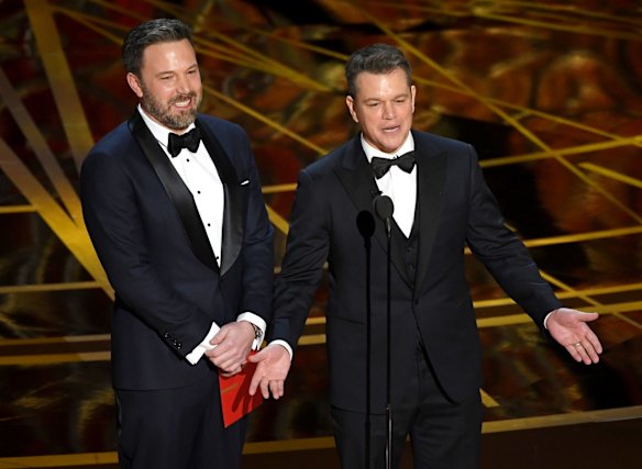 Ben Affleck and Matt Damon present an award.