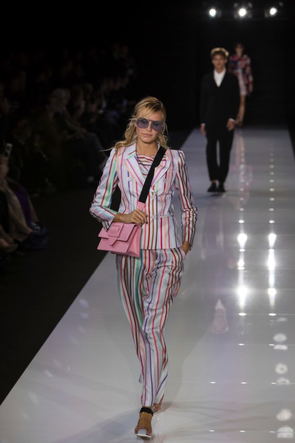 Models wear creations by designer Emporio Armani during their Spring/Summer 2018 runway show at London Fashion Week.