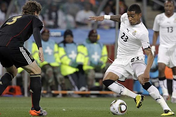 Kevin-Prince Boateng of Ghana controls the ball from Arne Friedrich of Germany.