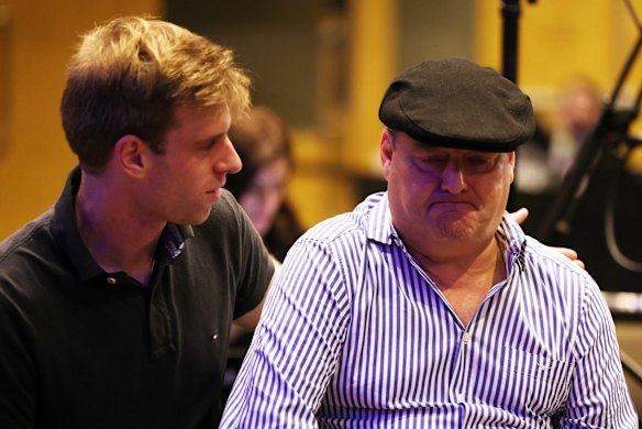 Liberal supporters react to the election results at the Fullerton Hotel in Sydney.