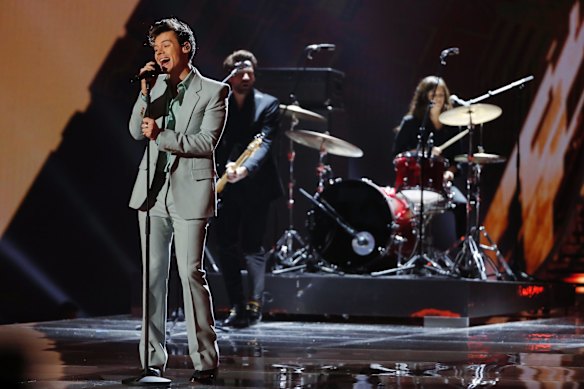 Singer Harry Styles opened the show in a pale green suit by Givenchy with a turquoise shirt.