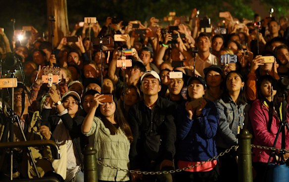 Crowds capture the moment during the Sydney Harbour fireworks on New Year's Eve.