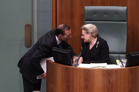 Prime Minister Tony Abbott speaks with  Speaker Bronwyn Bishop during a division in the House of Representatives at Parliament House in Canberra on Thursday 14th of November, 2013. 