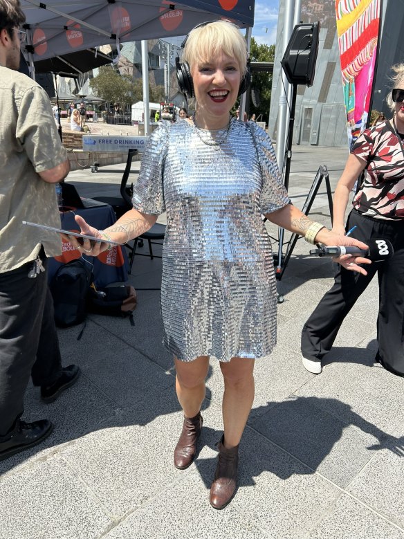 ABC broadcaster Jacinta Parsons gets into the Taylor Swift mood at an outside broadcast from Federation Square.