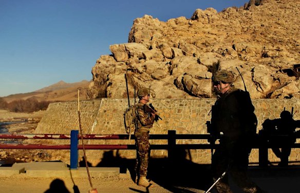 Australian soldiers patrol and search the Puza Bridge for IED's after an insurgent was arrested the night before with explosive matieral at this location. Dai Roshan Area in Uruzgan Province, Afghanistan.