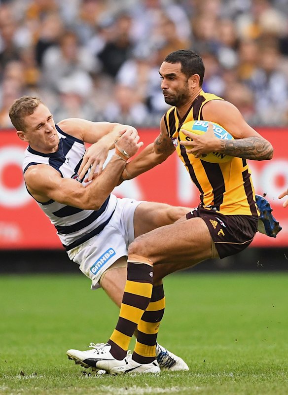 2017 Shaun Burgoyne is tackled by Joel Selwood of the Cats.
