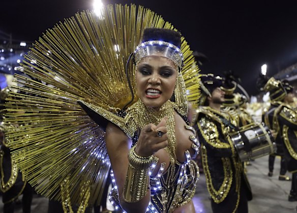A dancer from the Vai-Vai samba school performs during a carnival parade in Sao Paulo, Brazil, Sunday.