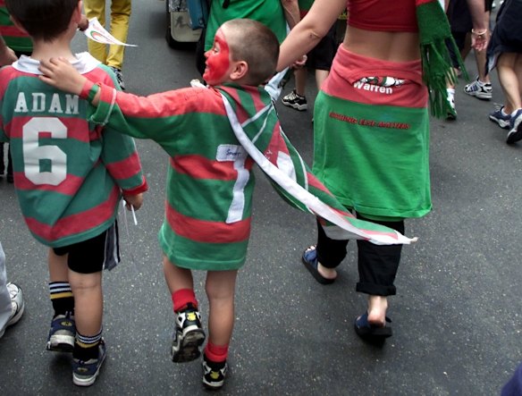 Kids march along George Street as part of a protest march for the South Sydney Rugby League team from the leagues club in Redfern to the Sydney Town Hall. Circa 2000.
