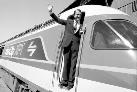 NSW Premier Neville Wran takes the controls of the new XPT train on 24 August 1981.