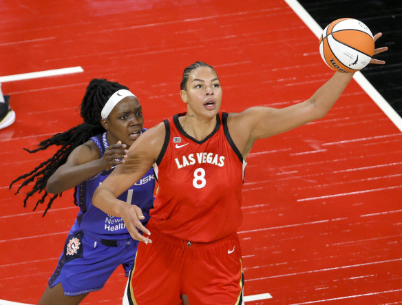 Liz Cambage of the Las Vegas Aces catches a pass under pressure against the Connecticut Sun.