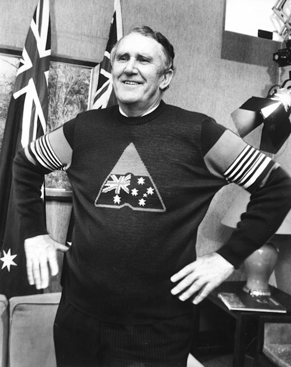 The Prime Minister Malcolm Fraser tries on an Advance Australia jumper during the filming of his opening speech for the Advance Australia music and dance festival. 1982