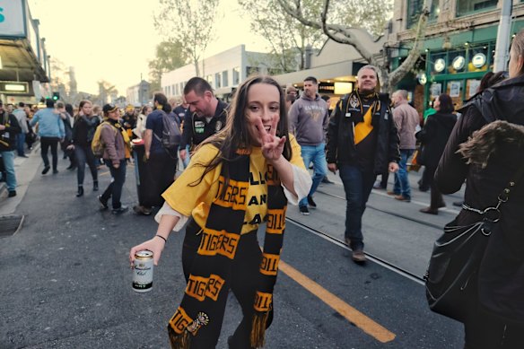 Richmond supporters celebrating their teams win over Adelaide during the AFL Grand Finals in Swan st Richmond.  Photo Luis Enrique Ascui