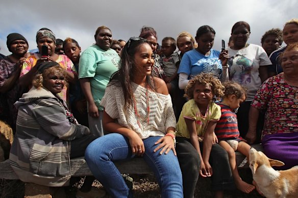 Jessica Mauboy hugs a young Aboriginal girl who was brought to tears when she joined Jessica Mauboy during her performance at Watson on The Nullabor Plain in South Australia for children from Oak Valley Aboriginal School. The concert in Watson is the highlight of many performances across Australia on the Indian Pacific Outback Christmas Train. 