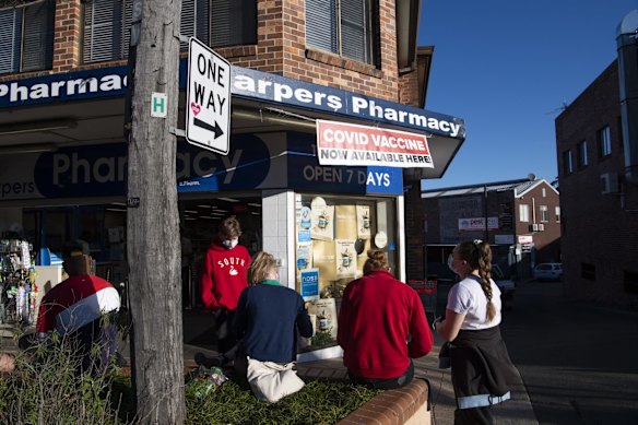 Queues for walk in COVID-19 Vaccinations at Harpers Pharmacy, Earlwood in the Canterbury Bankstown LGA.