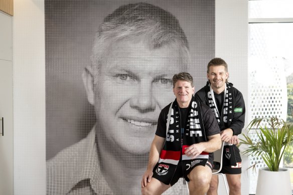 Never forgotten: St Kilda legend Robert Harvey and current player Dan Butler pose in front of a mural of Danny Frawley ahead of “Spud’s Game”.