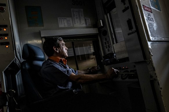 Vince Vassiliou drives on the historic final S-Set trip over the Sydney Harbour Bridge.