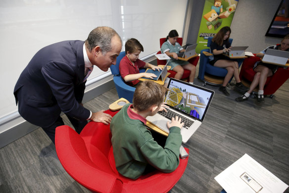Education Minister James Merlino with students in Melbourne in April.