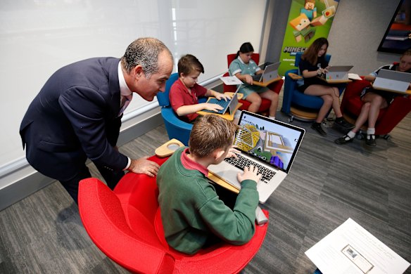 Education Minister James Merlino with students in Melbourne in April.