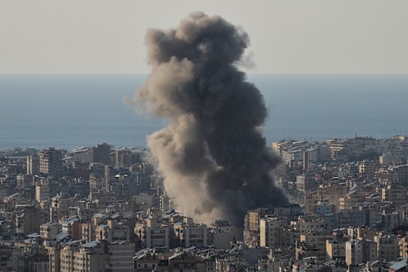 Smoke rises from Israeli airstrikes on Dahiyeh.