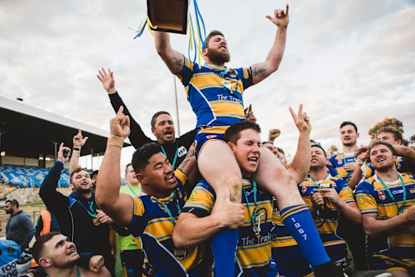 Woden Valley Rams captain Jeffrey Morgan celebrates their win.
