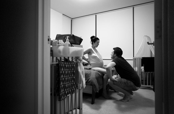 Michael Box supports Lea Fenton during her labour at home before going into the Royal Hospital for Women in Randwick, Sydney. 