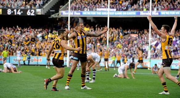 Hawthorn's Paul Puopolo, Lance Franklin and Jack Gunston celebrate on the siren.