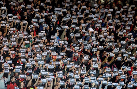 Guingamp's supporter hold signs reading "Je suis Charlie" (I am Charlie) to pay tribute to the victims of the Charlie Hebdo attack during the French L1 football match between Guingamp and Lens at the Roudourou stadium in Guingamp, western France, on January 10, 2015.
