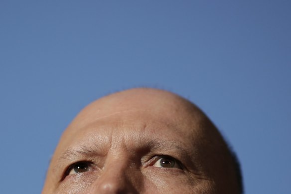 Minister for Home Affairs Peter Dutton addresses the media during a doorstop interview at Parliament House in Canberra.