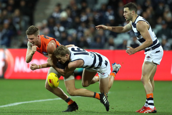 Second best: GWS defender Aidan Corr of the Giants gets bailed up by Geelong's Scott Selwood.