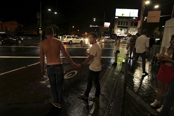 Early morning scenes on Oxford Street after the 2014 Sydney Gay and Lesbian Mardis Gras. Lockout rules had been implemented forcing pubs, bars and clubs to close at 1.30am in an effort to curb alcohol-fuelled violence.