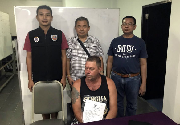  Australian Stephen Allan Carpenter, front center, is detained by police in Pattaya, Thailand. 