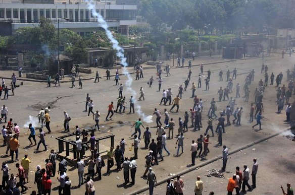 Supporters of Egypt's ousted President Mohammed Morsi clash with security forces near the largest sit-in by supporters of Morsi in the eastern Nasr City district of Cairo, Egypt.