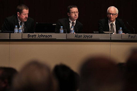 Qantas board members Brett Johnson (left), Qantas CEO Alan Joyce(center) and Paul Rayner (right) at the Qantas AGM at the Sir John Clancy Auditorium, University of NSW, Kensington, Sydney. 28th October, 2011. Photo by Kate Geraghty