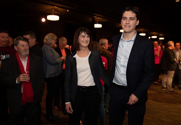 Nathan Albanese and his mother, former NSW deputy premier Carmel Tebbutt, join supporters of the Labor party and leader Anthony Albanese to watch the election count at the Canterbury-Hurlstone Park RSL Club in Sydney.