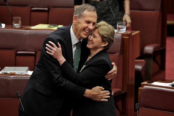 Bob Brown embraces deputy Greens leader Christine Milne after the carbon tax bills passed the Senate, November 2011.