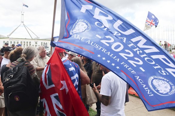Craig Kelly speaks with people at the Convoy to Canberra protest in front of Parliament House.