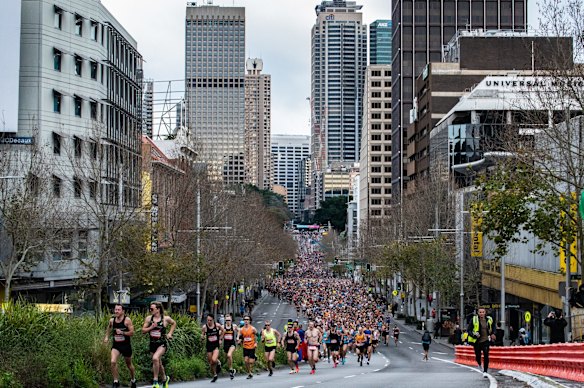 Runners head down Williams Street at the start of the City2Surf.