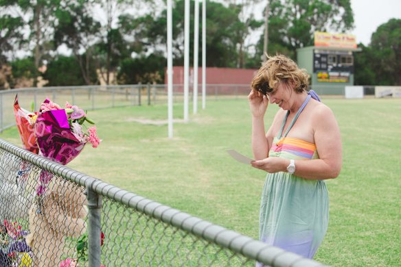 Luke Batty's mother, Rosie Batty back at Tyabb oval today reading cards well wishers have left following the murder of her son here 2 days ago.