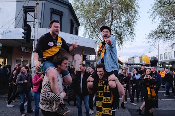 Richmond supporters celebrating their teams win over Adelaide during the AFL Grand Finals in Swan st Richmond.  Photo Luis Enrique Ascui