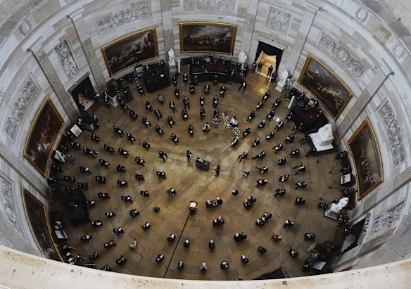 Mourners pay their respects during a ceremony memorialising US Capitol Police officer Brian Sicknick, as an urn with his cremated remains lies in honour at the centre of the Capitol Rotunda, February 3, 2021. Sicknick died on January 7, 2021, the day after he responded to the storming of the Capitol.