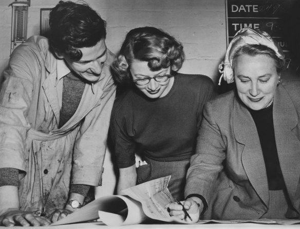 Frances Burke in her Melbourne studio supervises staff as they work on a length of fabric. 