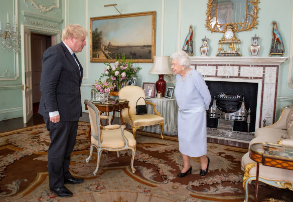 The Queen greets then prime minister Boris Johnson in June 2021.
